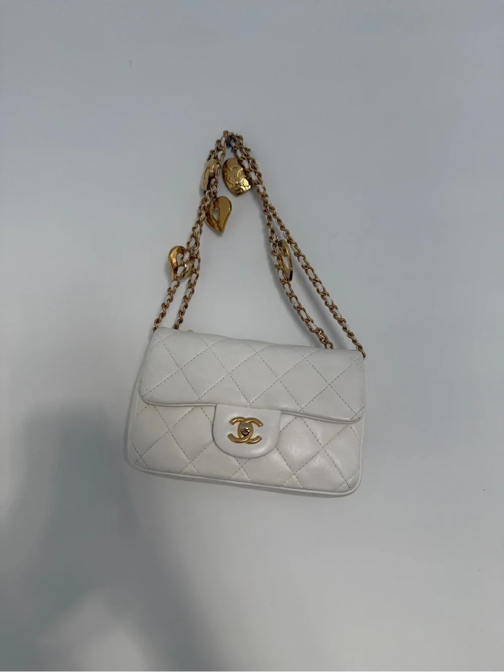 CHANEL White Quilted Mini Flap Bag with Gold Chain and CC Turn-Lock